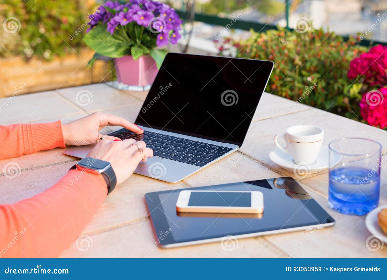 woman working with tech gadgets outdoors