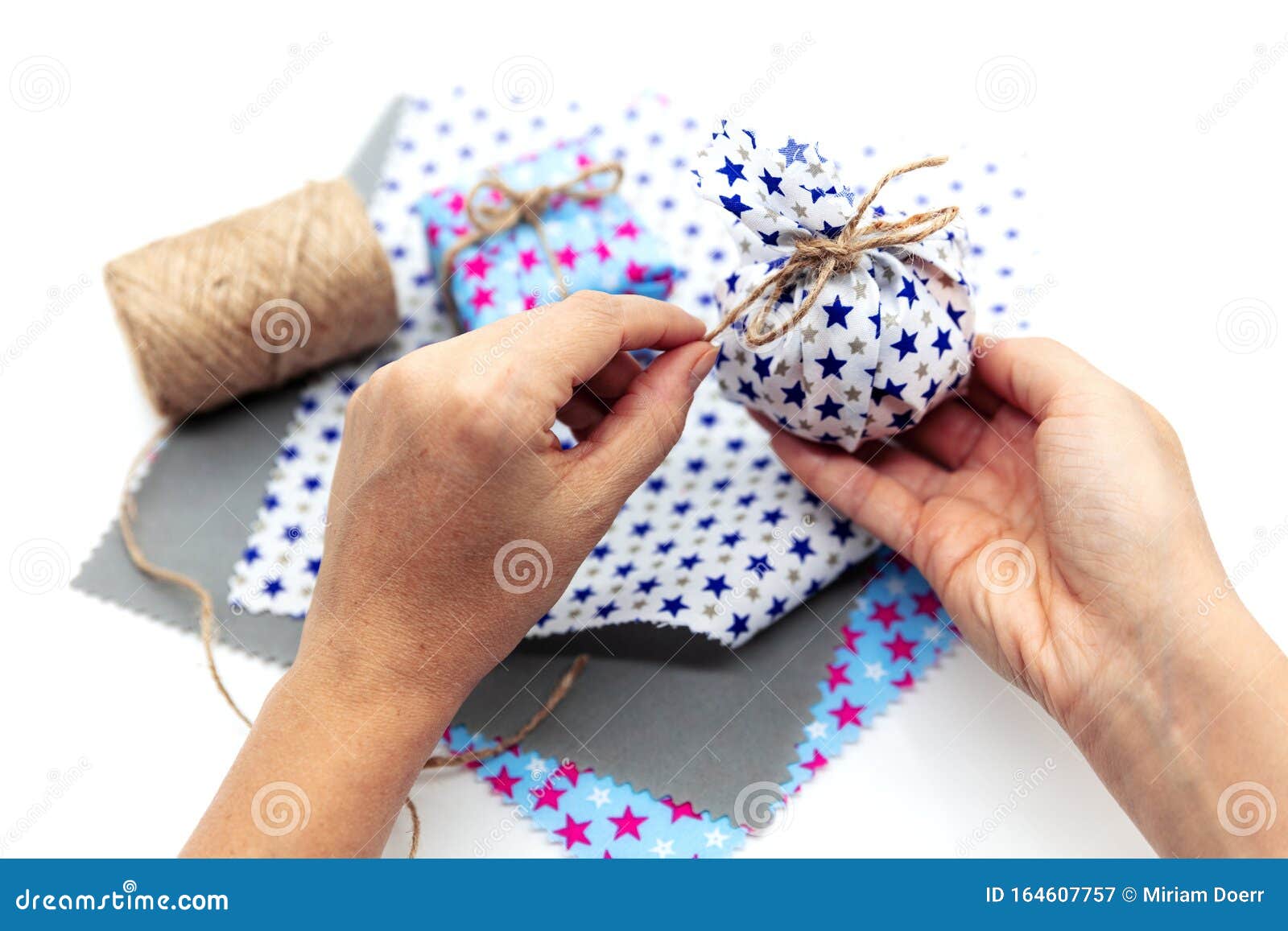 Woman Is Wrapping A Gift With Natural Materials And Organic Cotton Stock Image - Image of homemade, fabric: 164607757