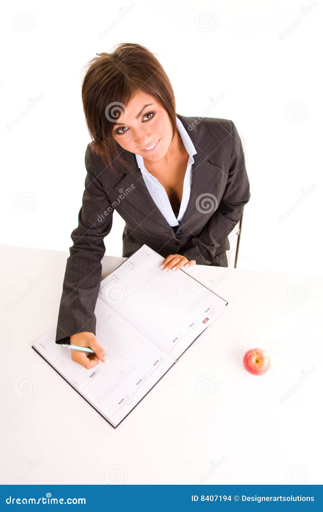 Woman writing in calendar stock photo. Image of glancing - 8407194