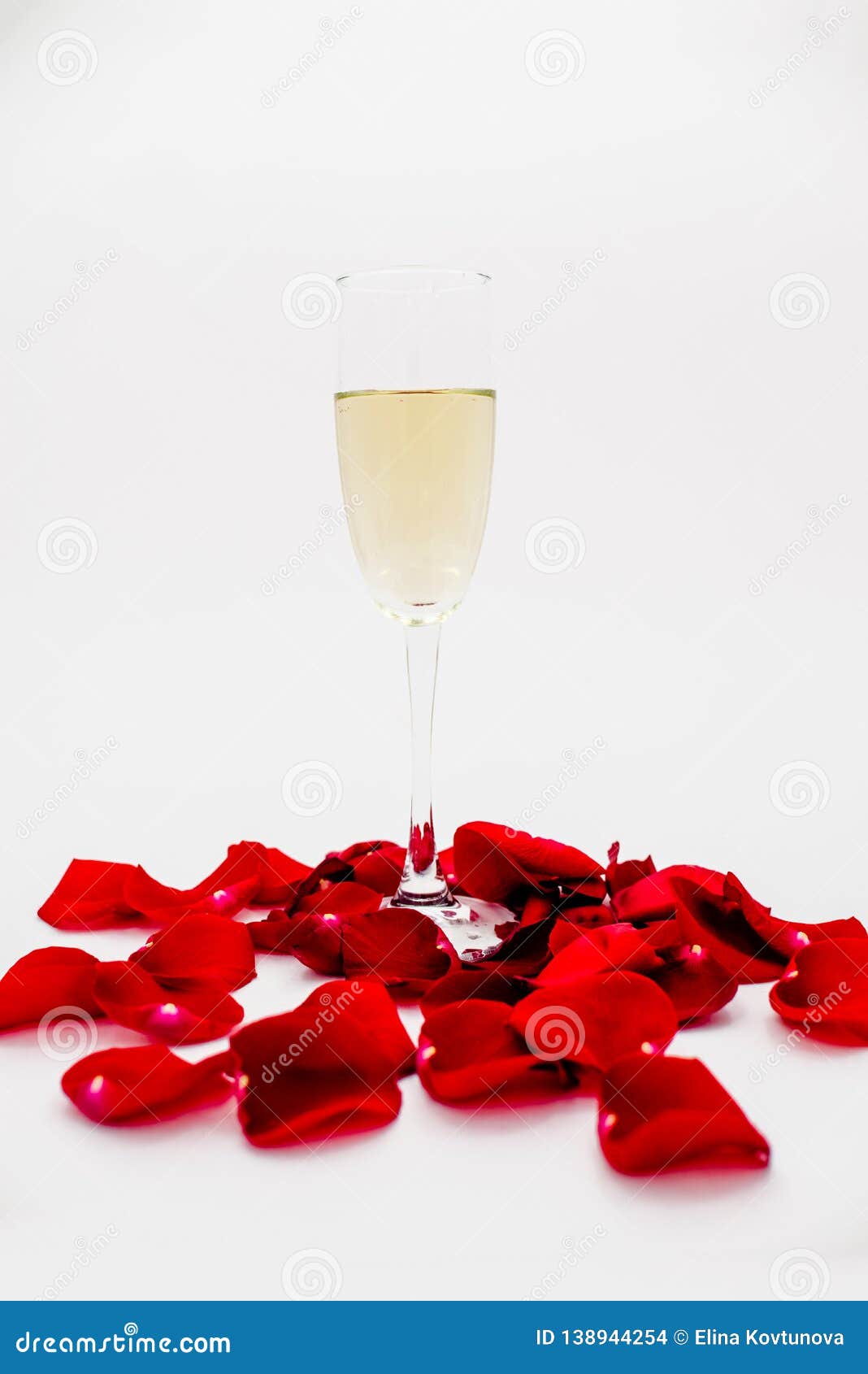 champagne glass with rose leaves abstract background