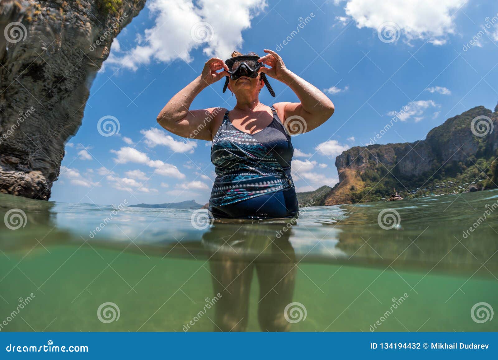woman in years going to immerse underwater