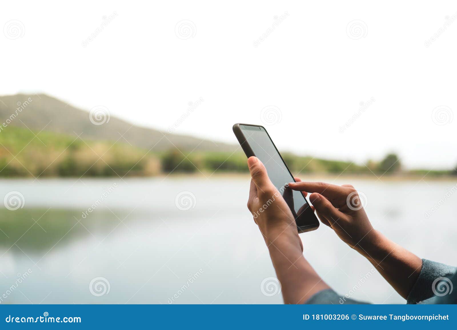 womanhand using smartphone to do work business, social network, communication in public cafe work space