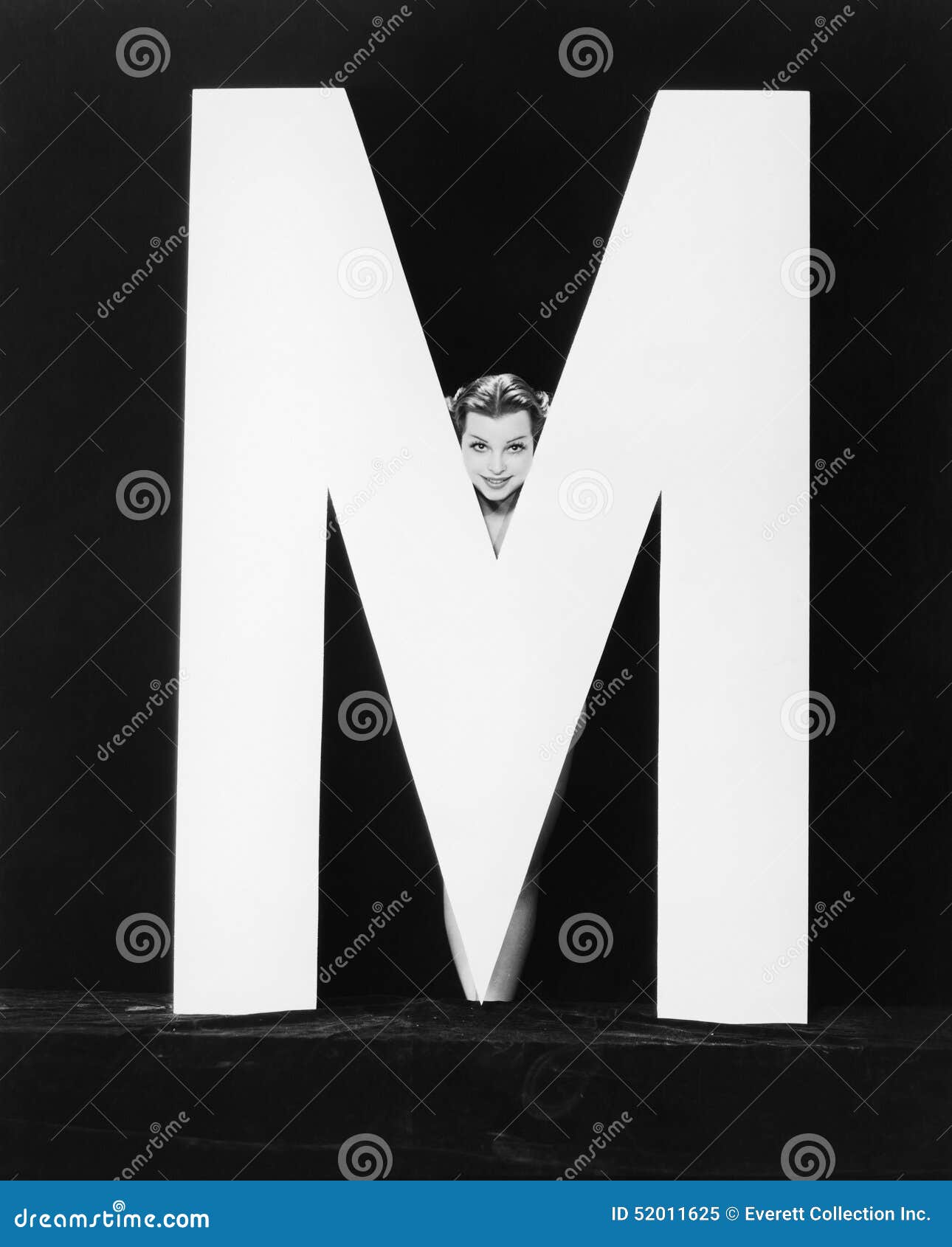 womans face with huge letter m