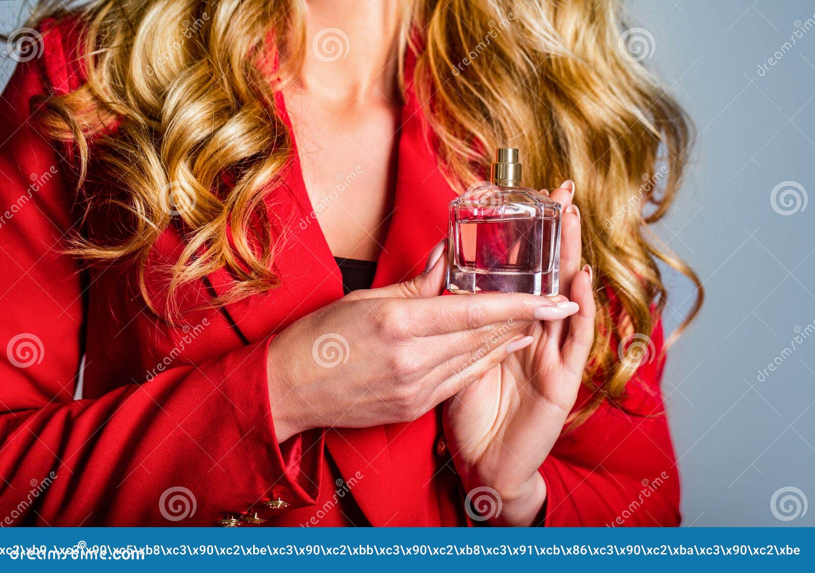 womans with perfum bottle. beautiful girl using perfume. woman with bottle of perfume. perfume bottle woman spray aroma