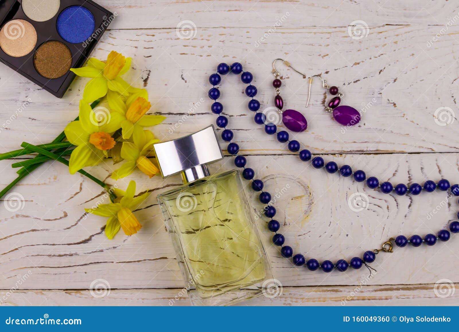 Women Accessories on White Wooden Background. Bottle of Perfume, Eye ...