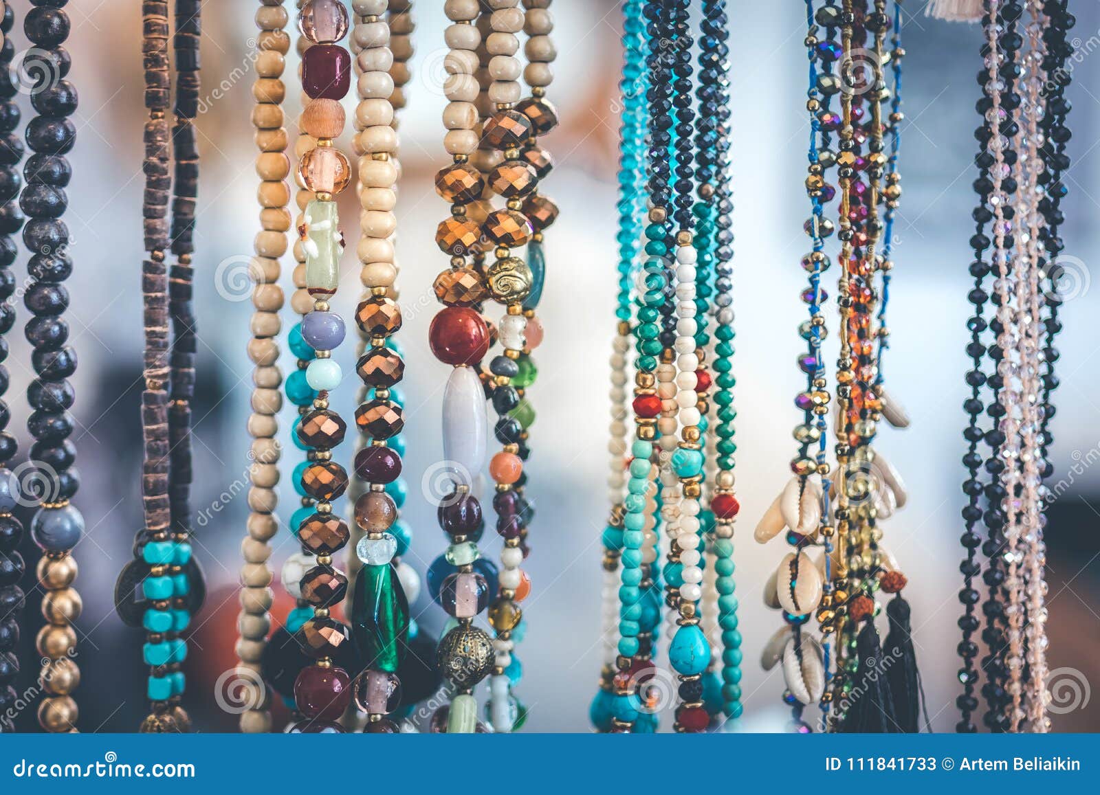 women beads and necklace in jewerly market. bali island.