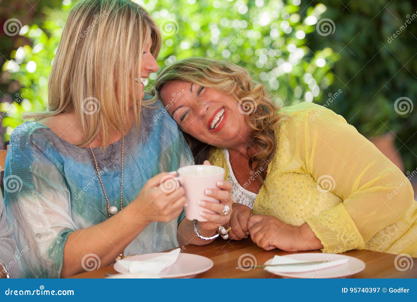 women, best friends laughing