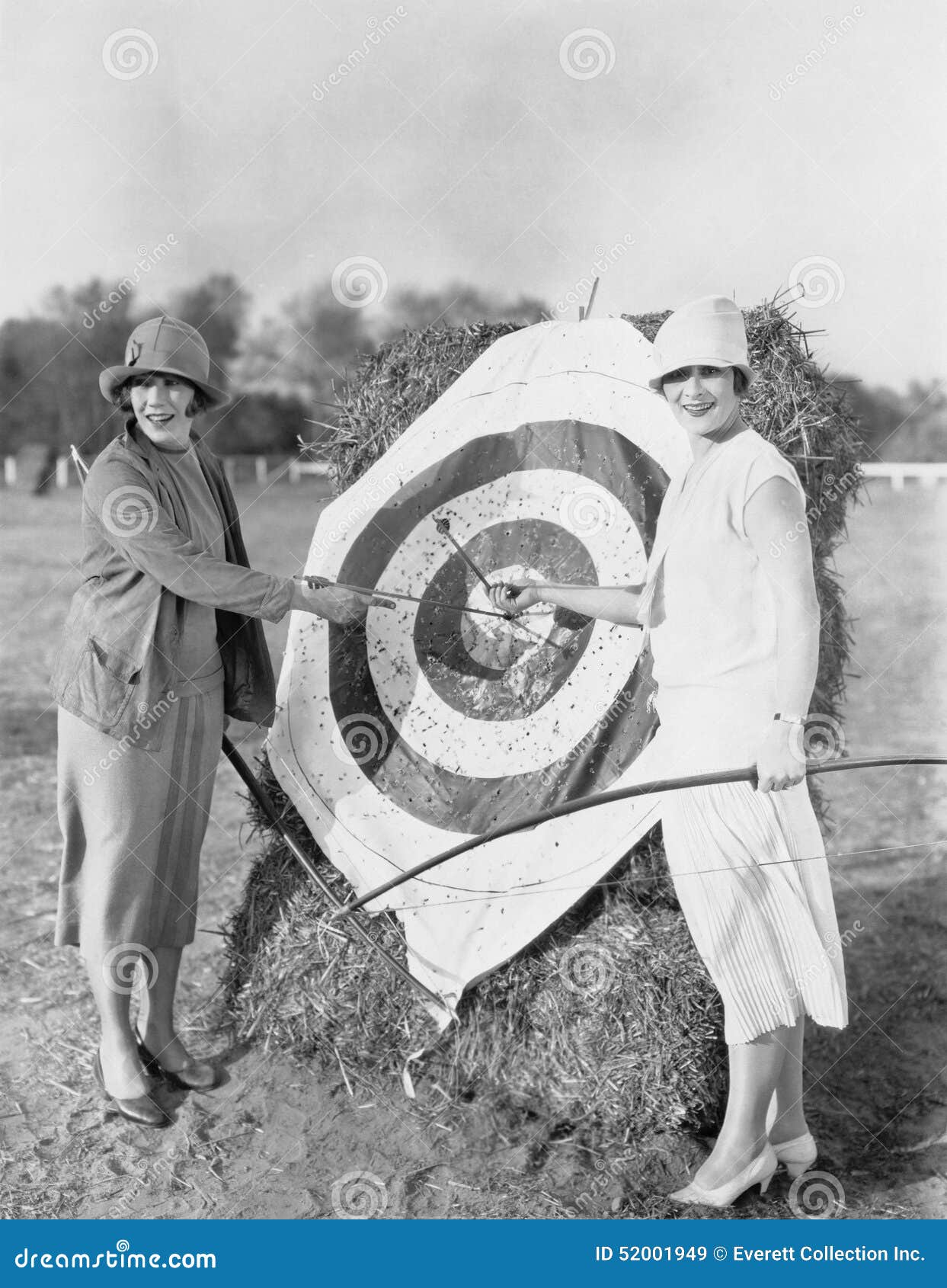 women with bulls eye in archery target