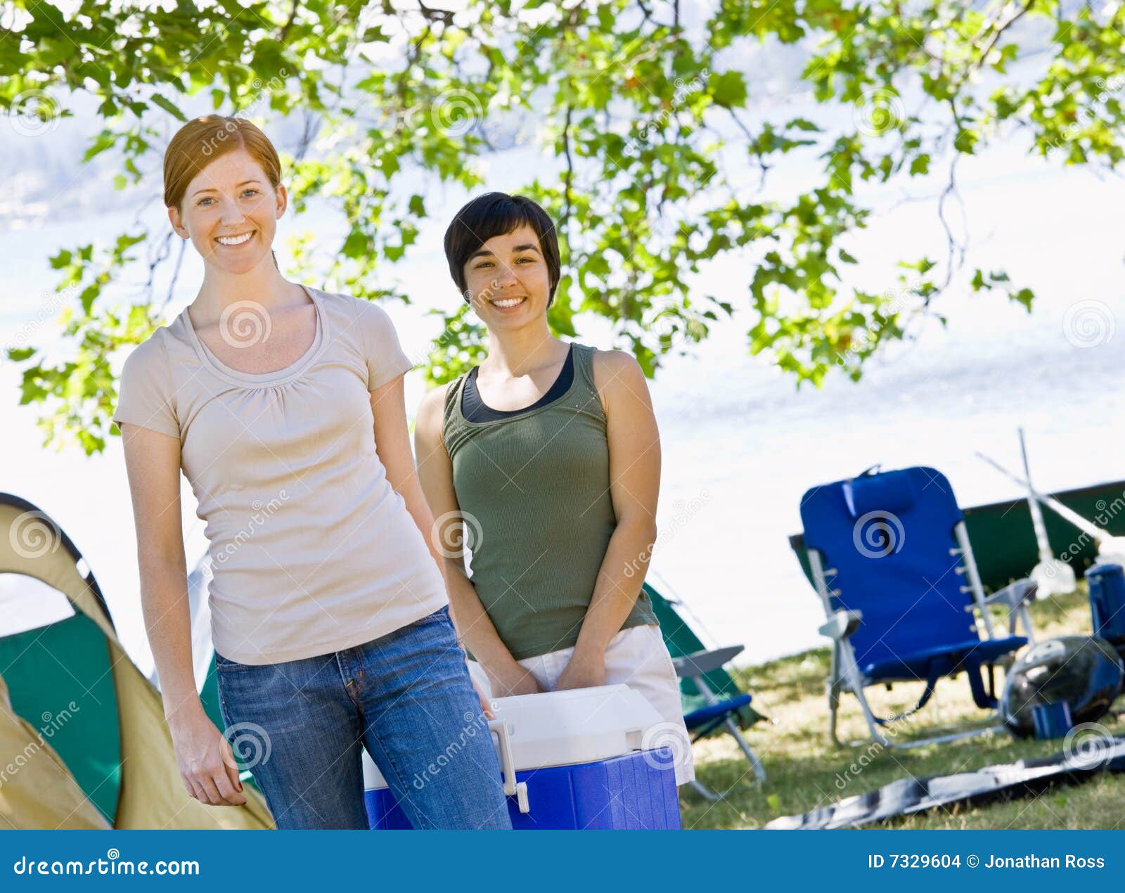 Women carrying cooler stock photo. Image of smile, female 7329604
