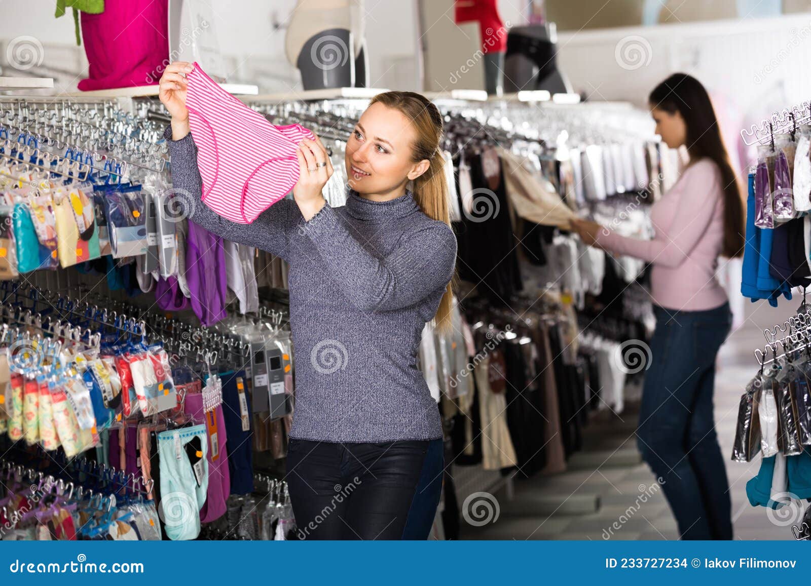 Women Choosing Underwear in Store. Stock Photo - Image of smiling