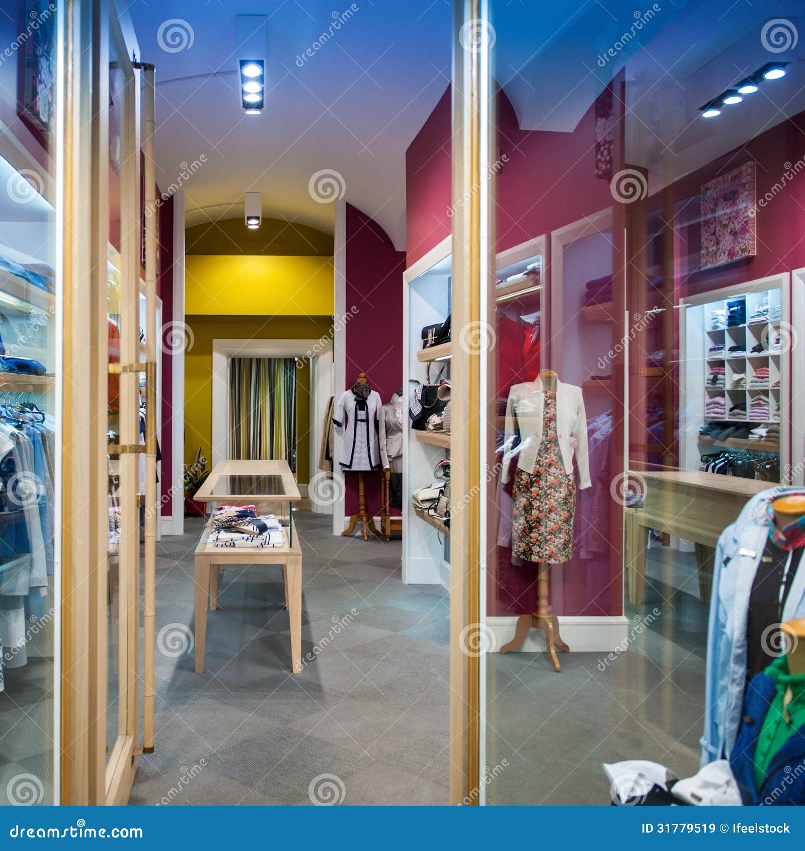 Interior view of women clothing store with diverse clothing and mannequins