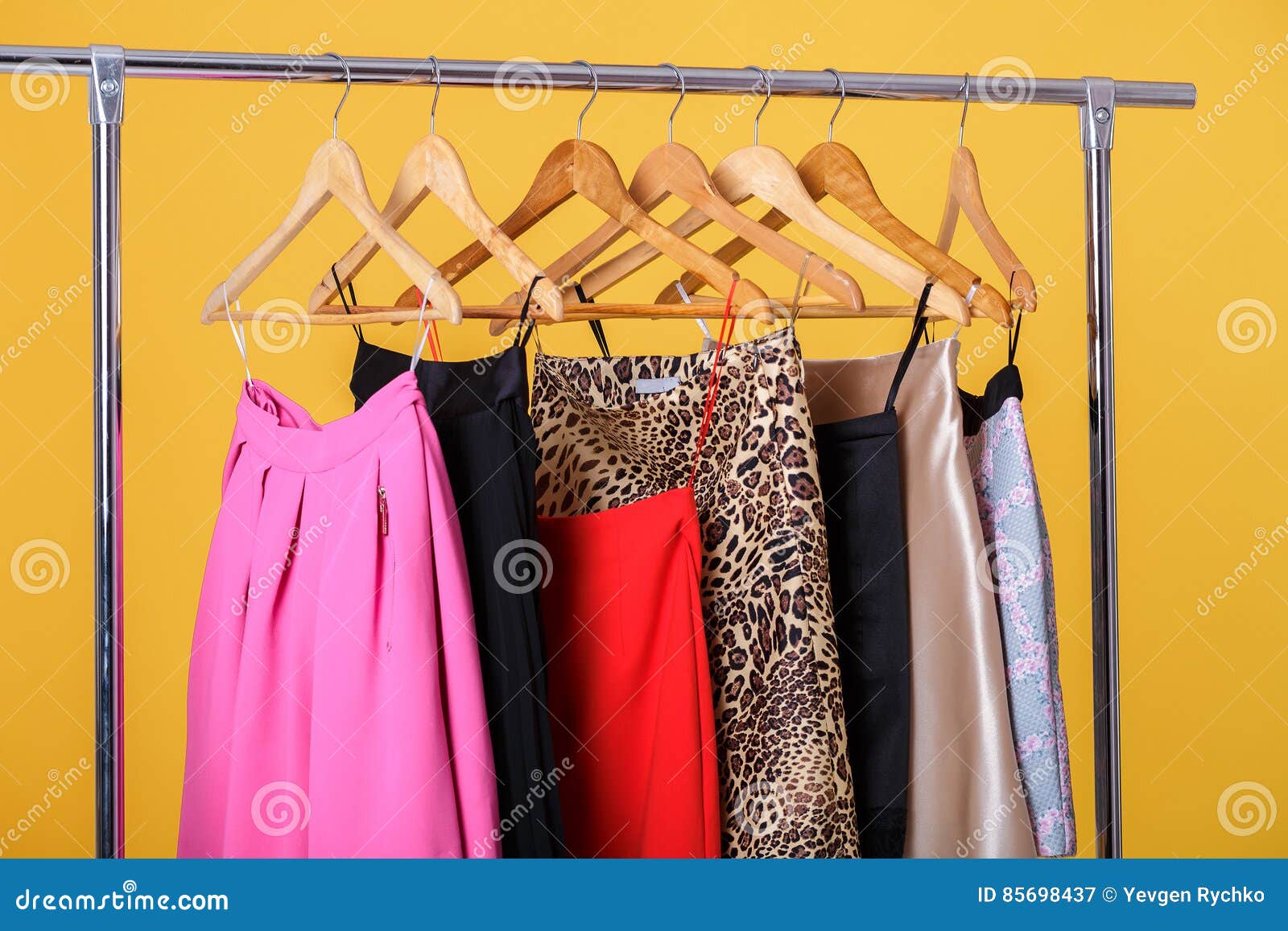 Women Colorful Skirts On Hangers On Rack On Orange Background. Stock ...