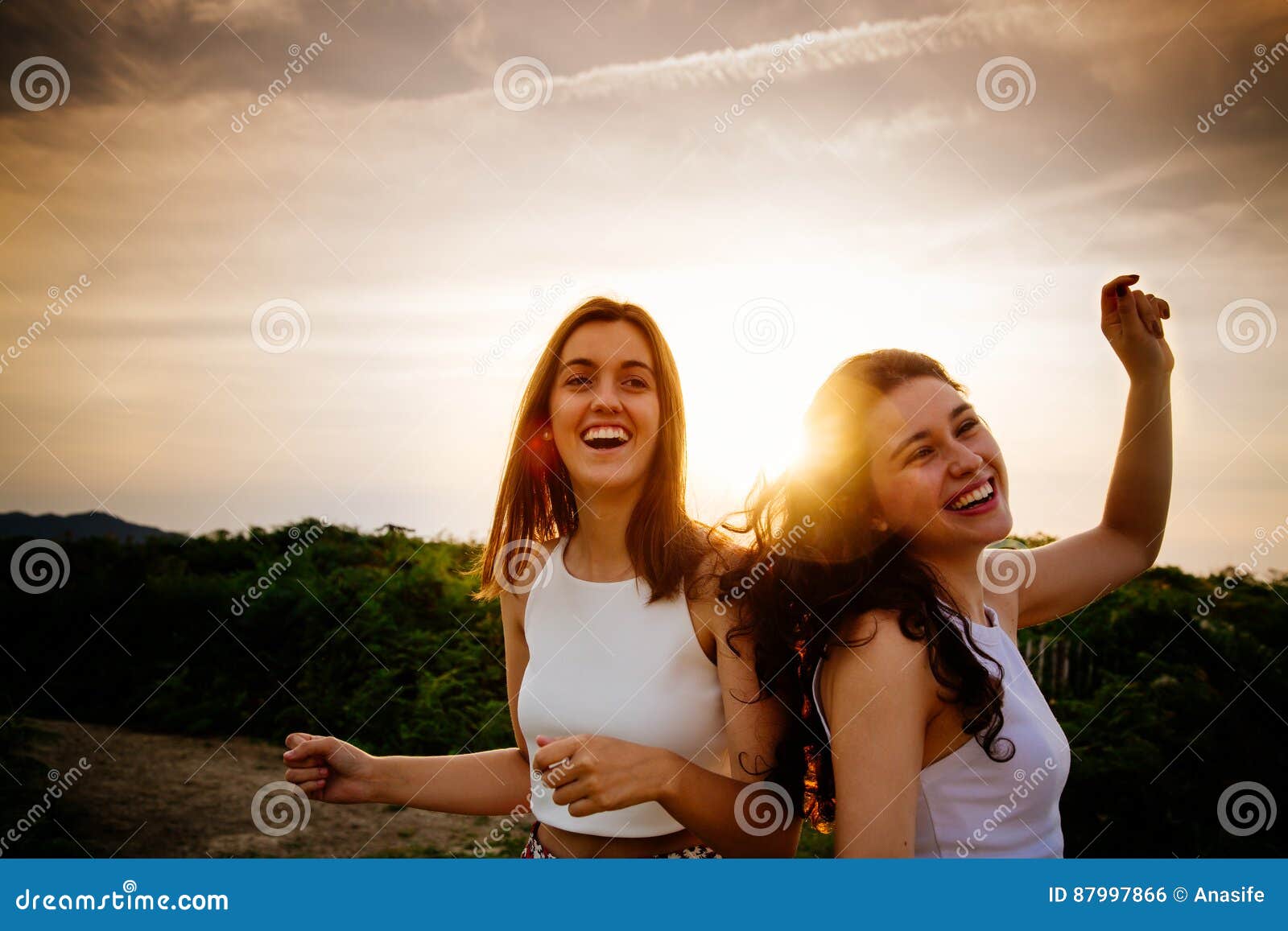 Women Dancing At Sunset Outdoors Stock Photo - Image of party, dusk ...