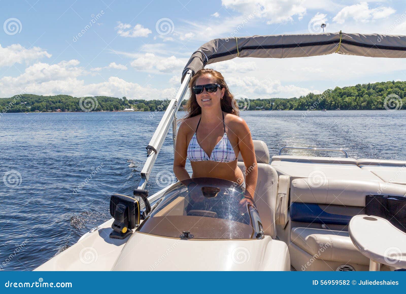 Women Driving A Pontoon Boat On A Lake Stock Photo - Image ...