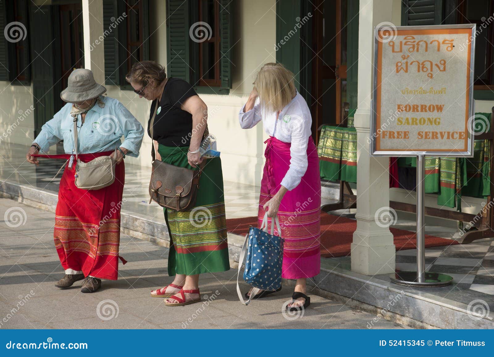 Women Fasten Their Borrowed Sarongs before Entering a Thai Temple ...