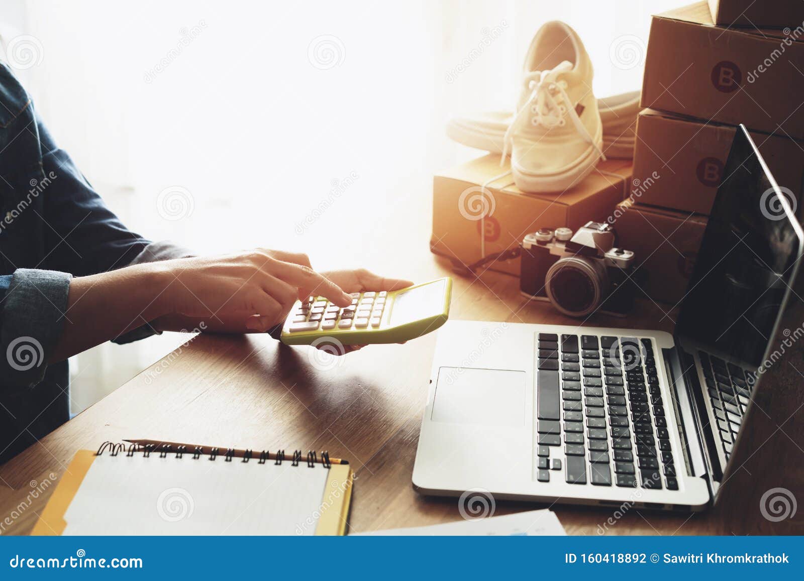 Women Hand Doing Finances And Calculate On Desk About Cost At Home