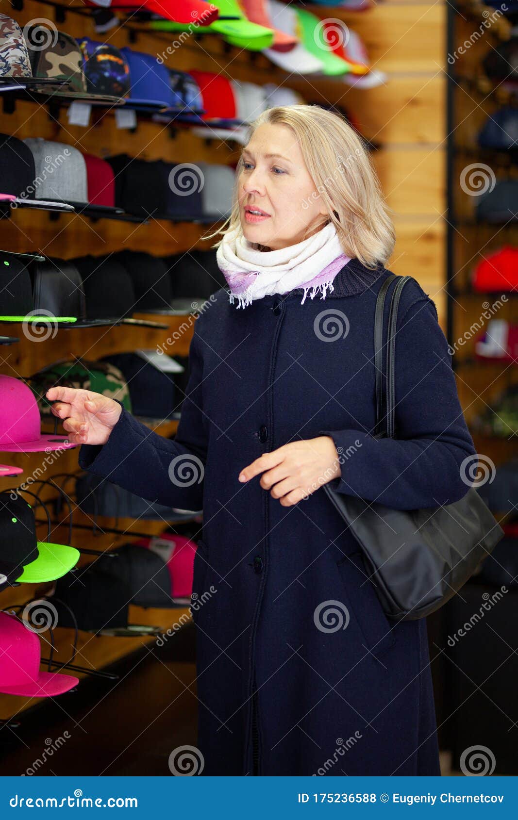 Women in a Hat Store Chooses a Hat. Stock Photo Image of caucasian