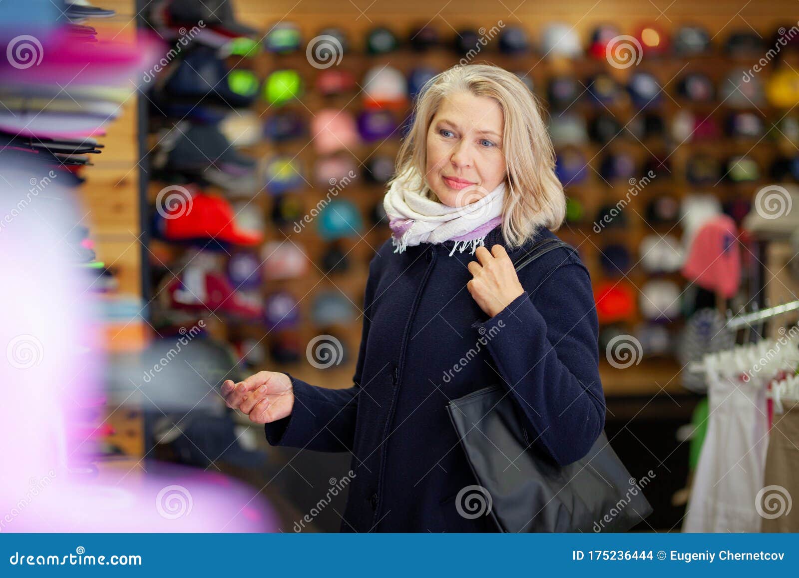 Women in Hat Store Chooses Baseball Cap. Stock Photo Image of purchase, attractive 175236444