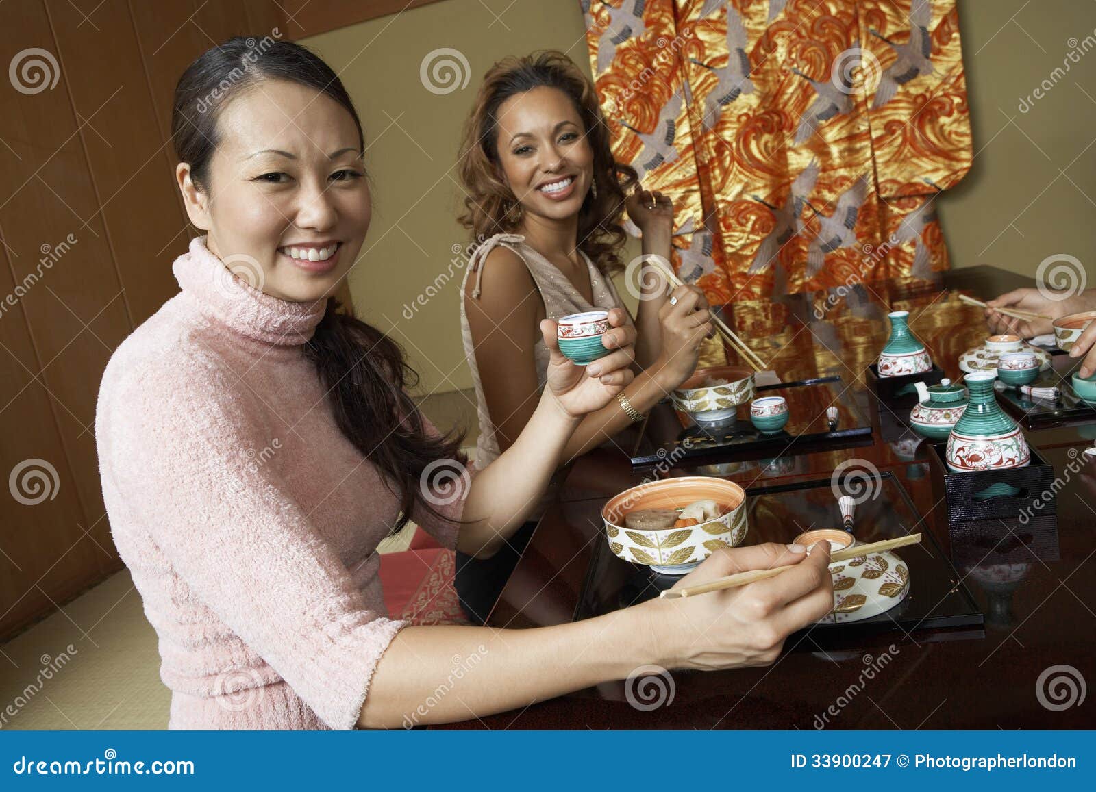 Women Having Japanese Saki in Restaurant Stock Image - Image of drink