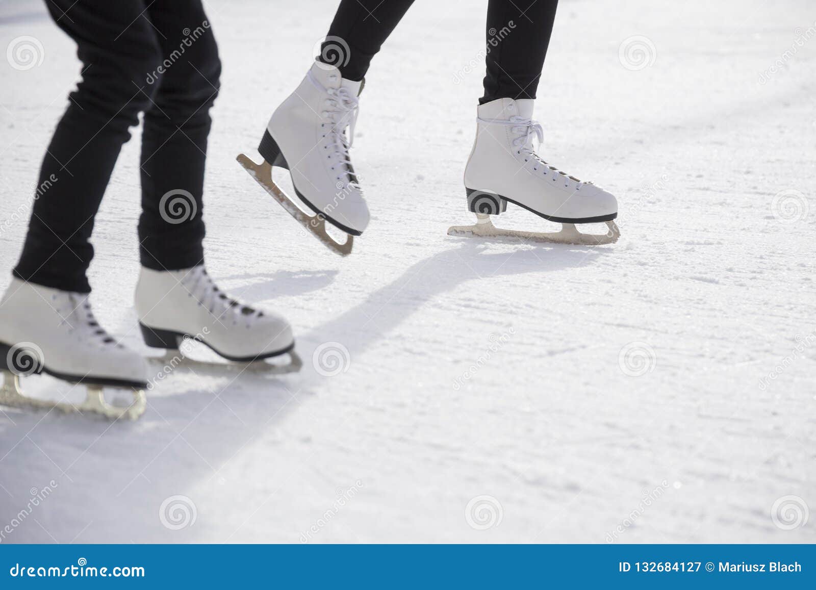 women ice skating on ice rink