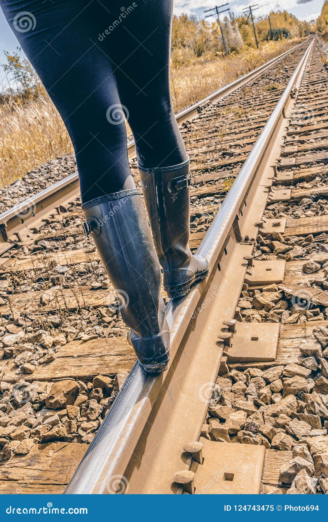 Single Woman Is Standing On Railway Track And Looking Into 
