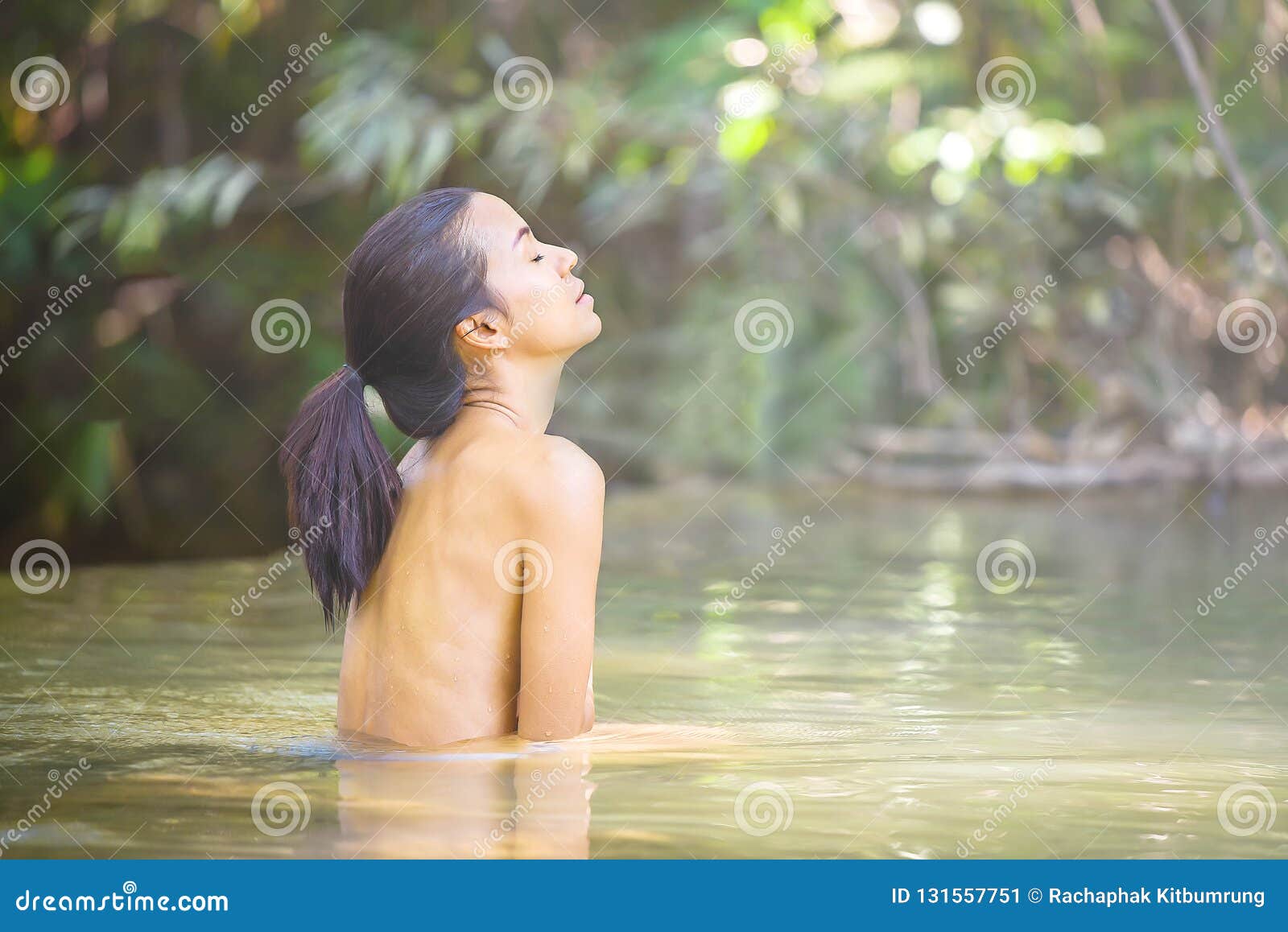 Watch her bathe her amazing girl body in the water
