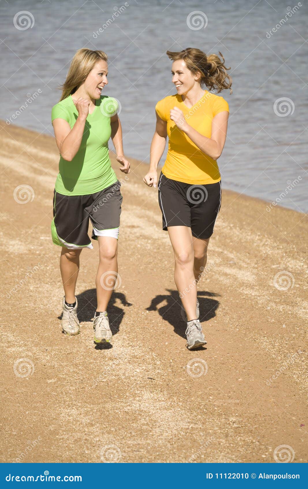 Women Running on Beach Laughing Stock Photo Image of water, blonde