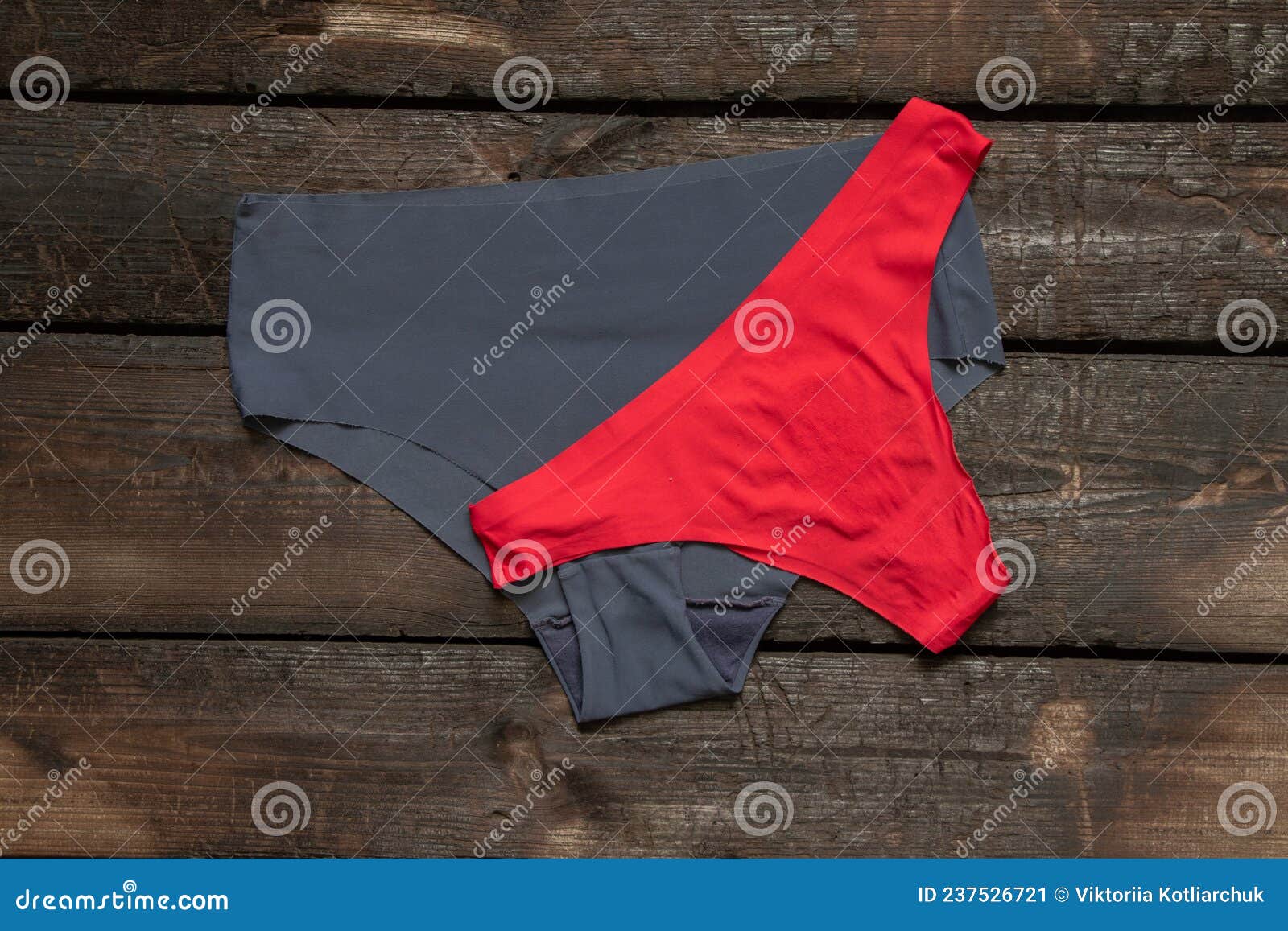 Women S Blue and Red Panties Lie on a Wooden Table, Women S