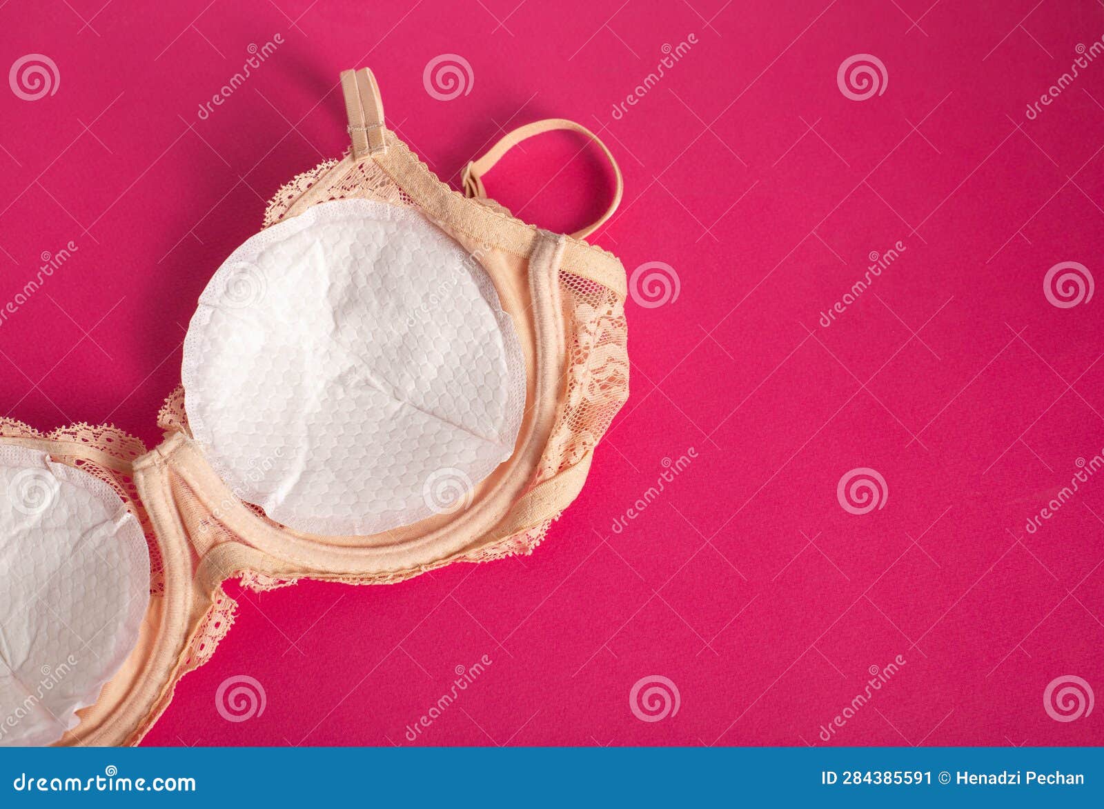 A Girl in a Black Bra Puts Pads from the Flow of Milk in Her Bra. Soft,  Hypoallergenic Breast Pads. Stock Photo - Image of bust, leakage: 284385582
