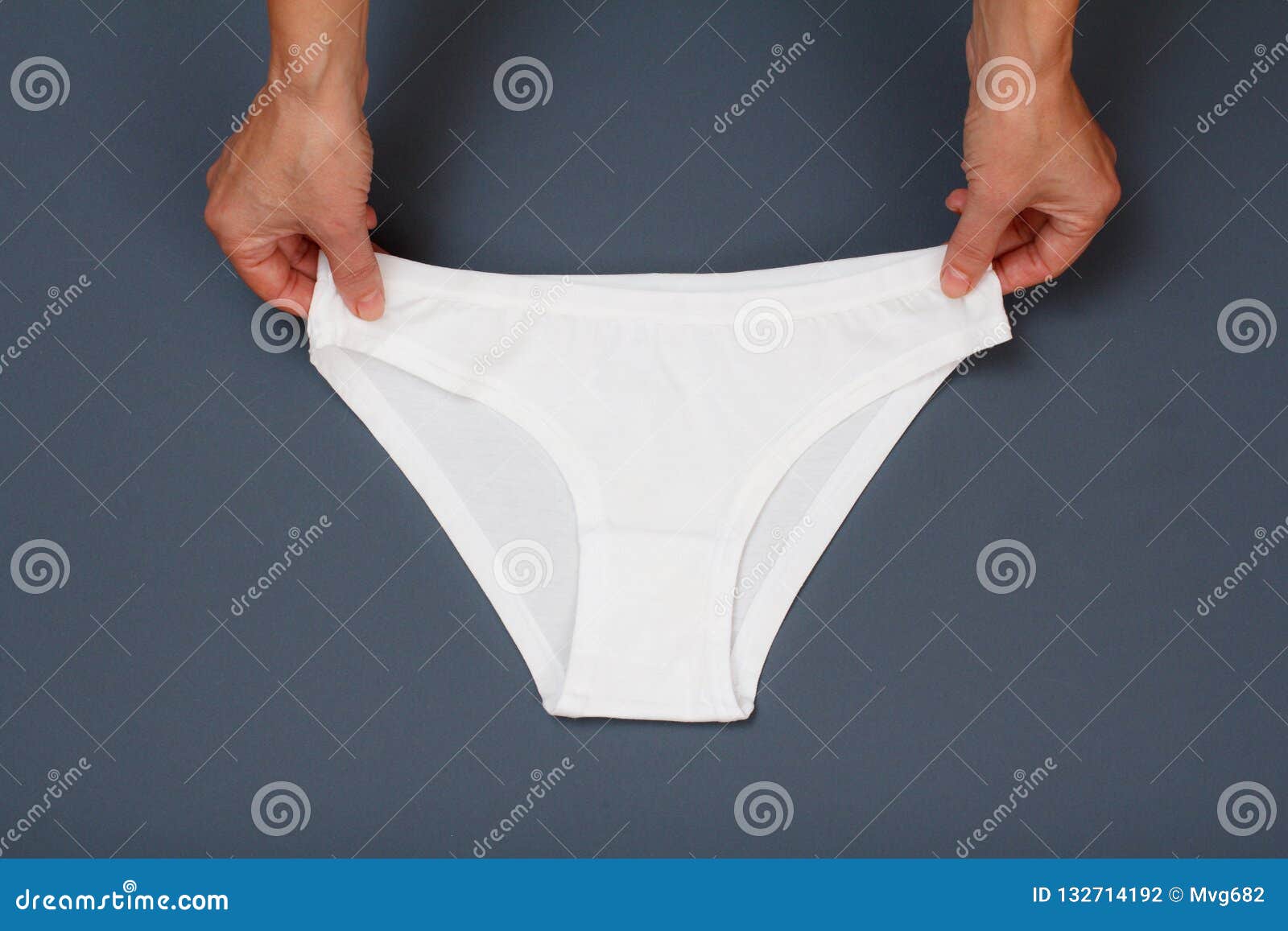 Women`s Hands with Beautiful Panties on Gray Background Stock Photo ...
