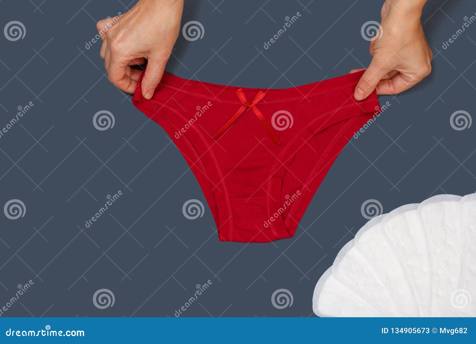 Women`s Hands With Beautiful Panties And Sanitary Pads On Gray Background Stock Image Image Of