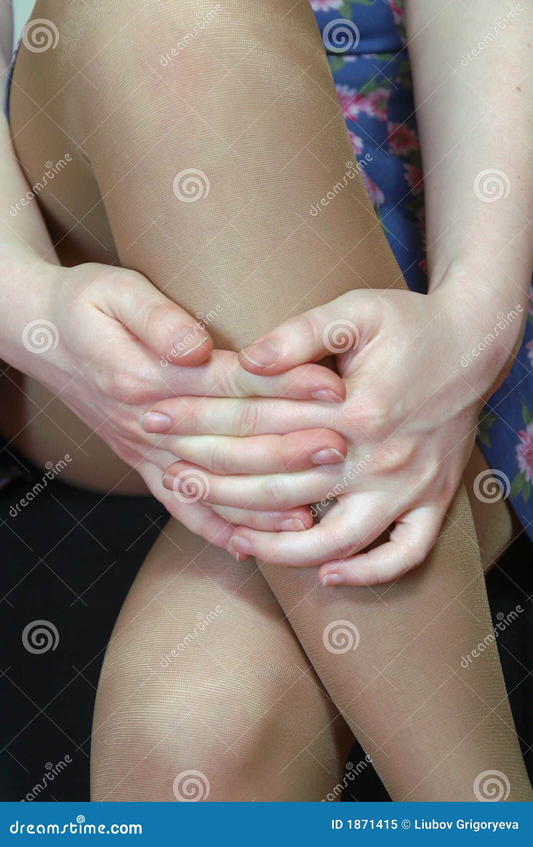 The Womens Hands On The Naked Knees Picture image