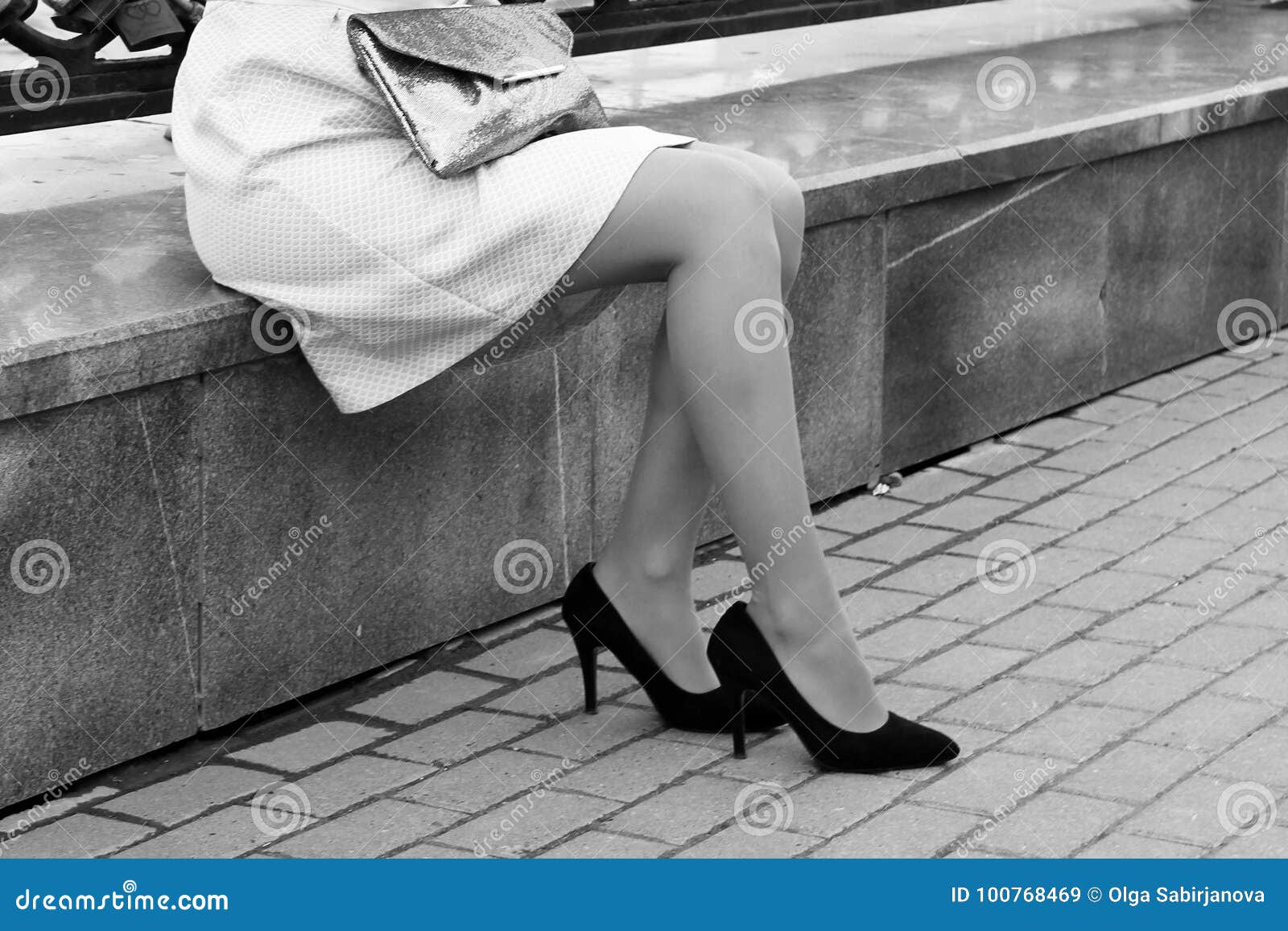 Women`s High Heeled Shoes Girl Sitting On Street Curb Stock Image