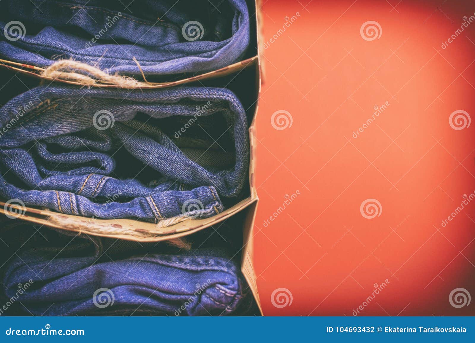 Women`s Jeans Folded In A Pile On A Colored Background. Made In A ...