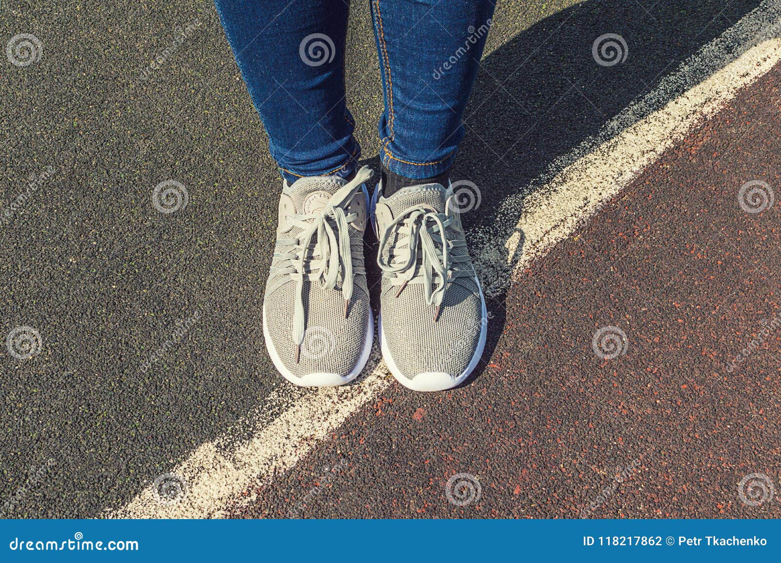 Female Feet in Sneakers on the Asphalt Stock Photo - Image of outdoor ...