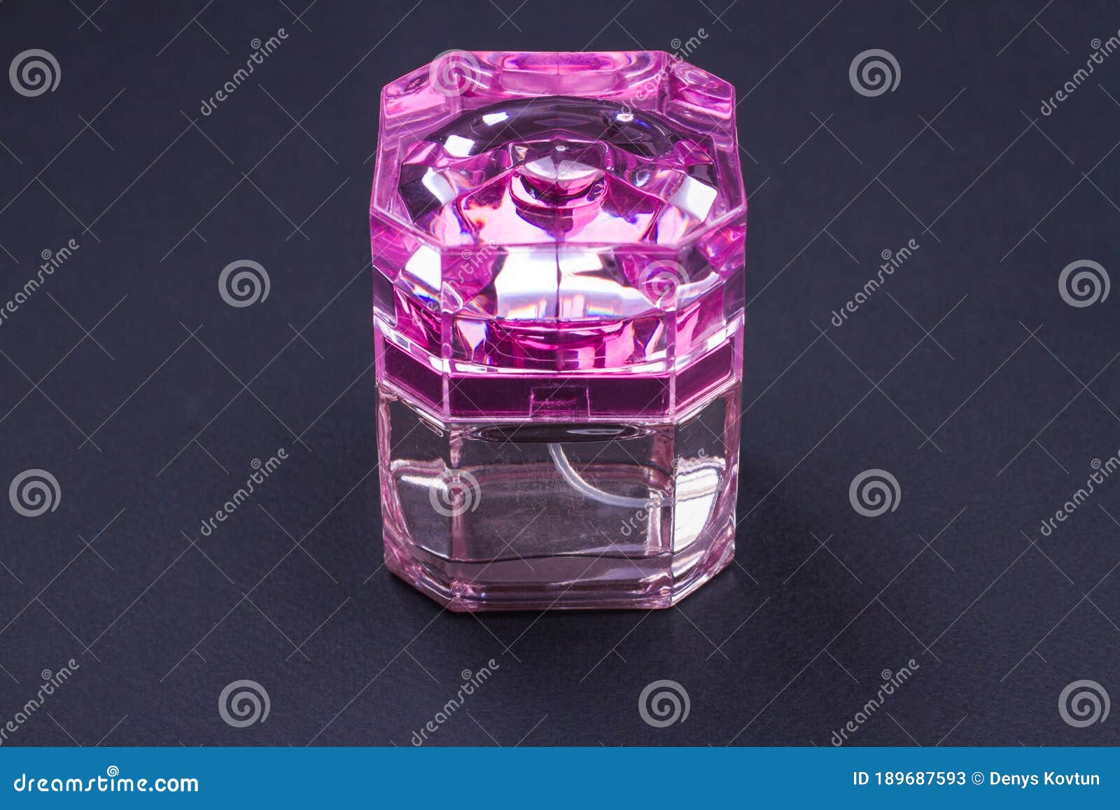 Women`s Perfume in Bright Pink Bottle on Dark Background. Stock Image ...