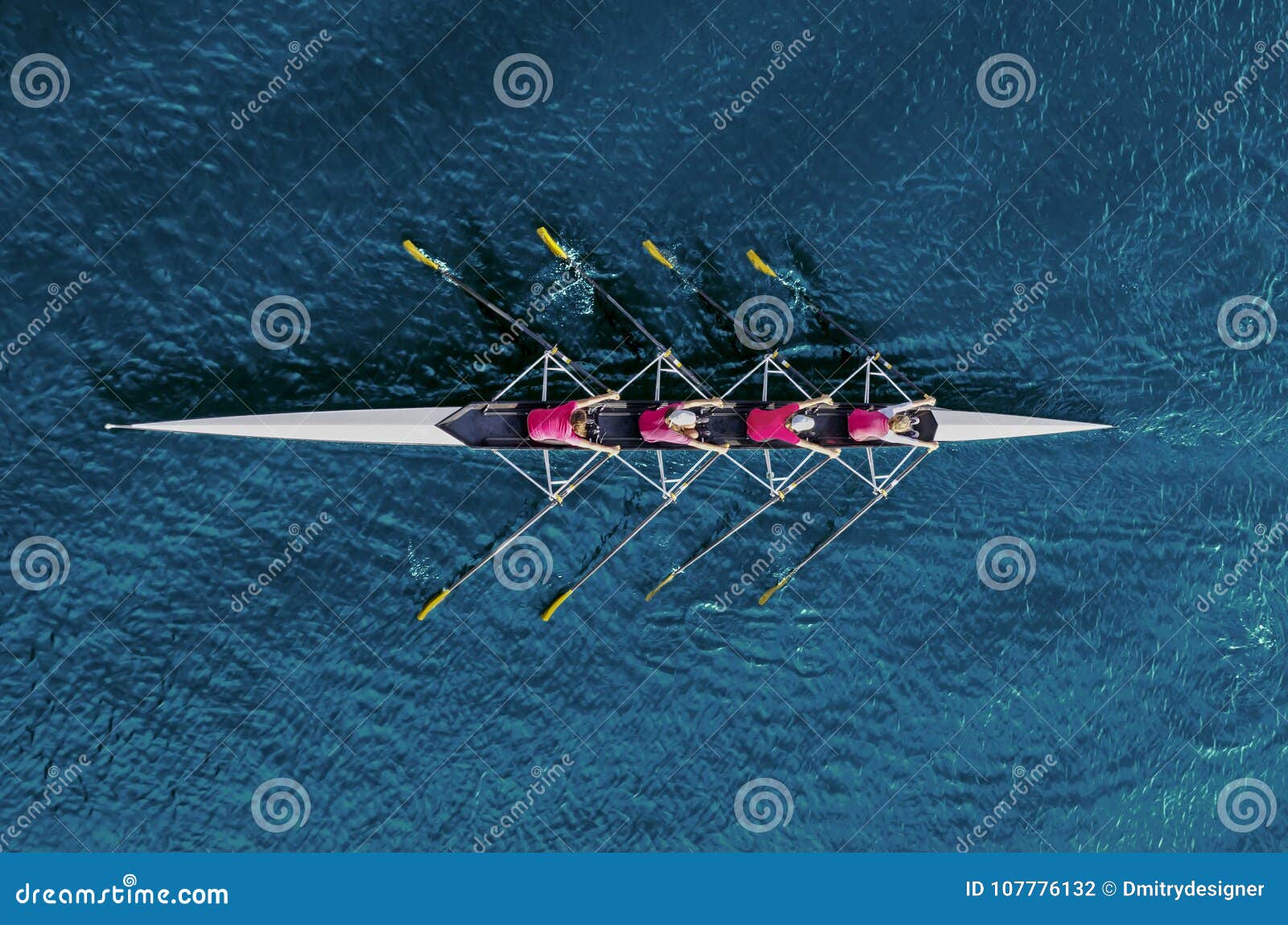 women`s rowing team on blue water