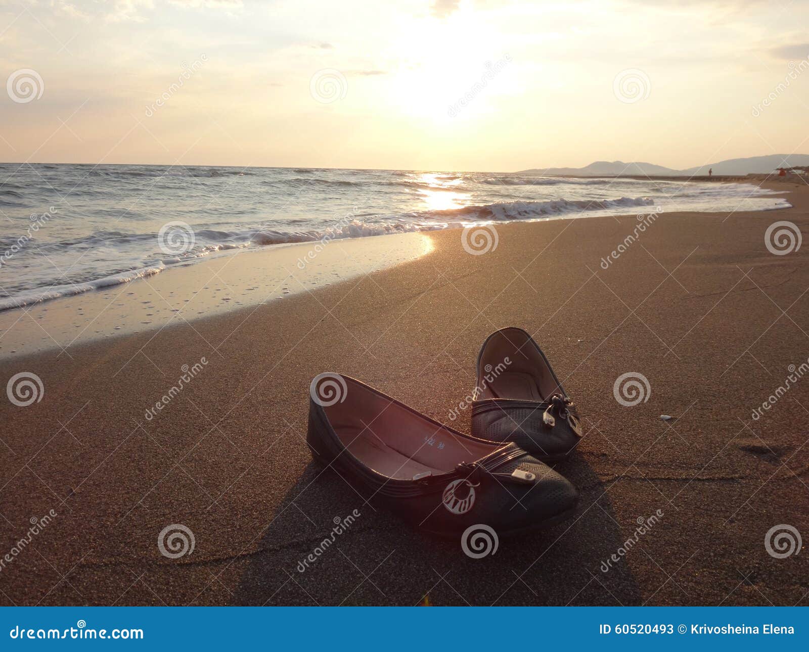 Women s shoes on the sand stock image. Image of glow 60520493