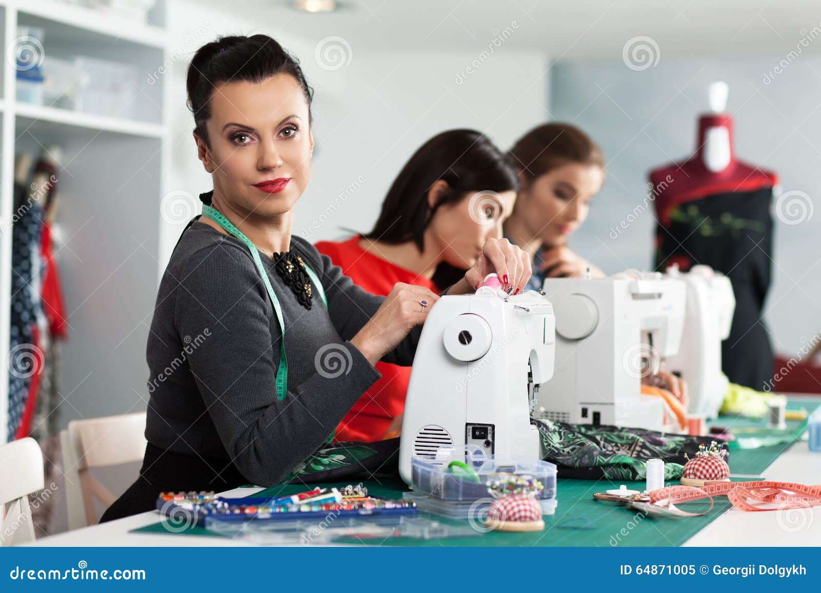 Women in a sewing stock image. Image of dressmaker 64871005