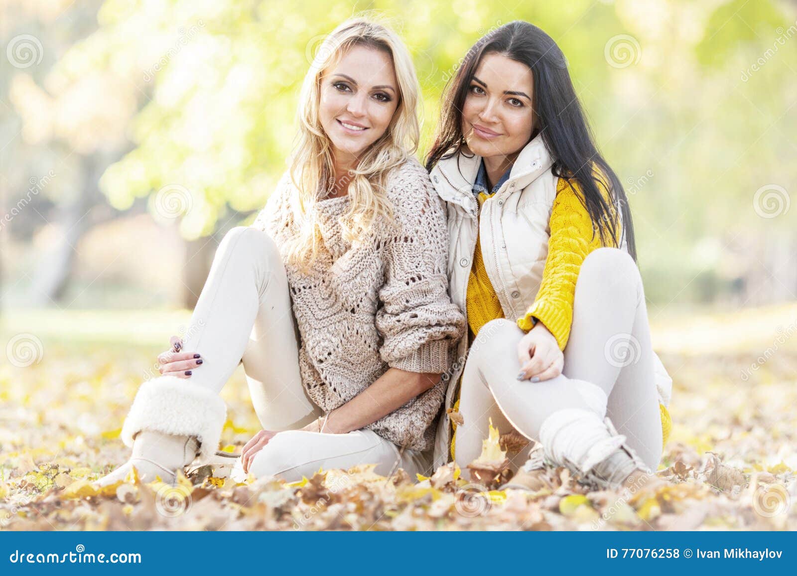 Women Sitting in Autumn Park Stock Photo - Image of beautiful ...