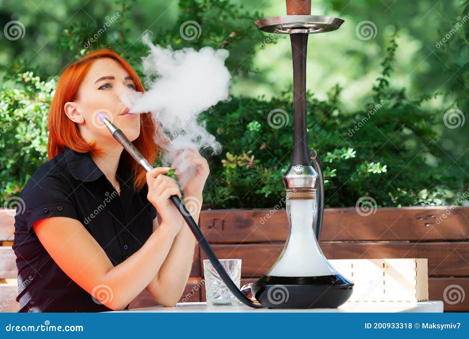 Women Smoke a Hookah in a Cafe on the Street Stock Photo Image of