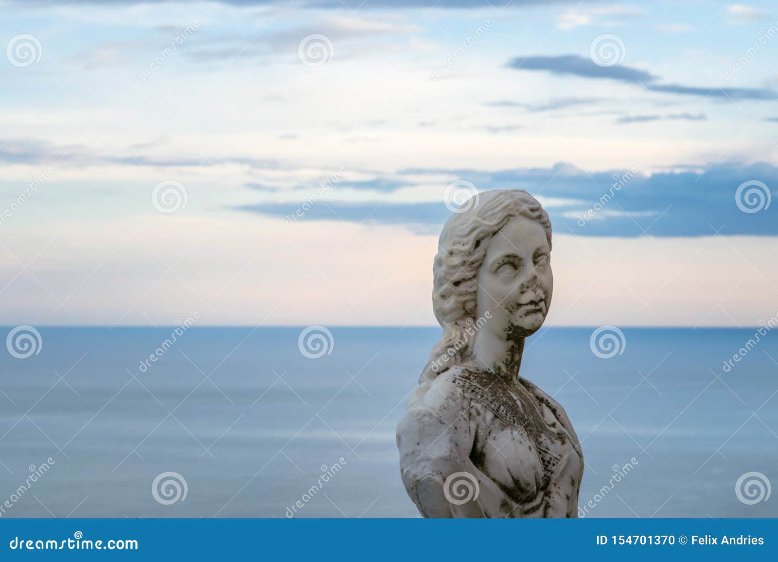 women statue from the belvedere, the so-called terrazza dell`infinito, the terrace of infinity seen on the sunset, villa cimbrone,