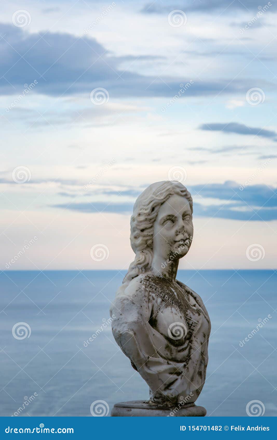 women statue from the belvedere, the so-called terrazza dell`infinito, the terrace of infinity seen on the sunset, villa cimbrone,
