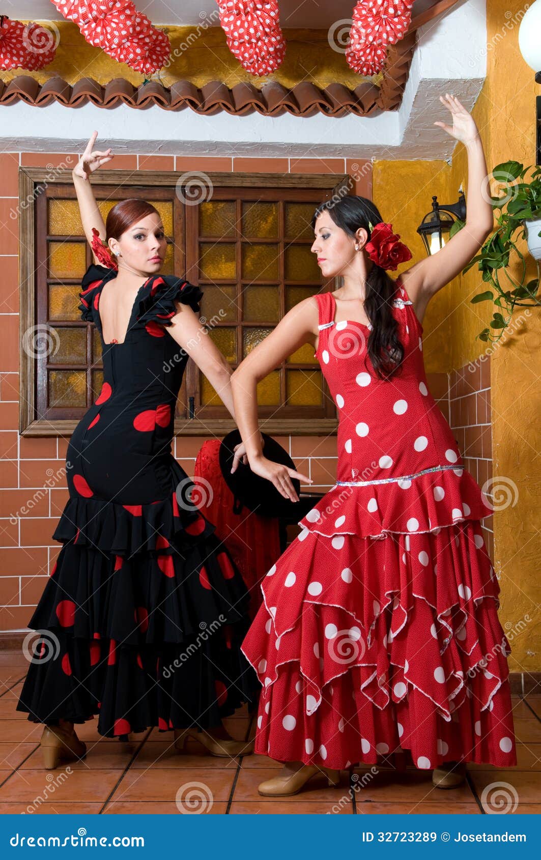 Women In Traditional Flamenco Dresses Dance During The Women In Traditional Flamenco Dresses Dance During The