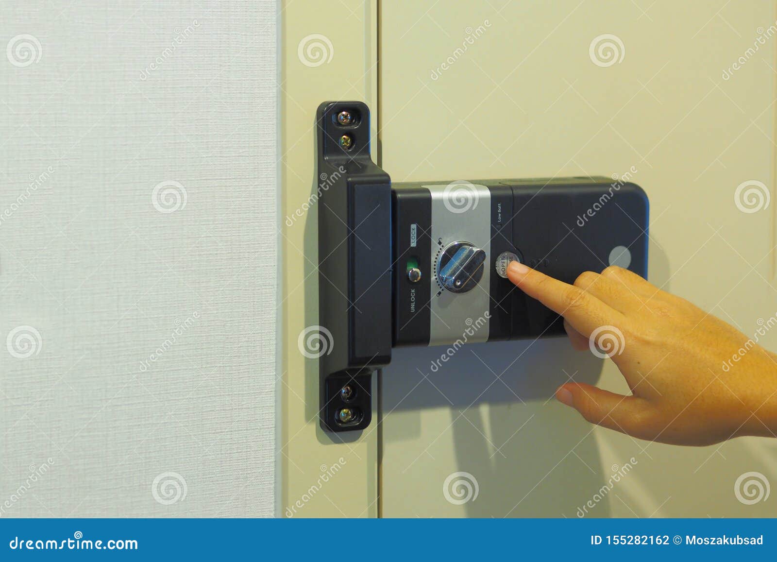 Women Are Using A Key Card To Open The Door To Enter The