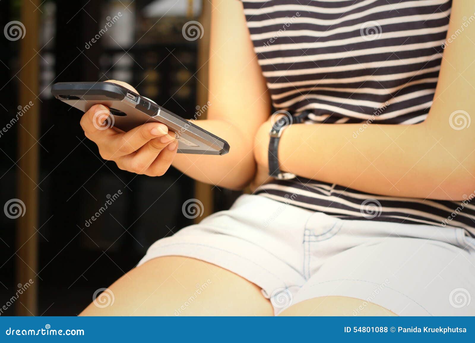 women are using a phone at the park