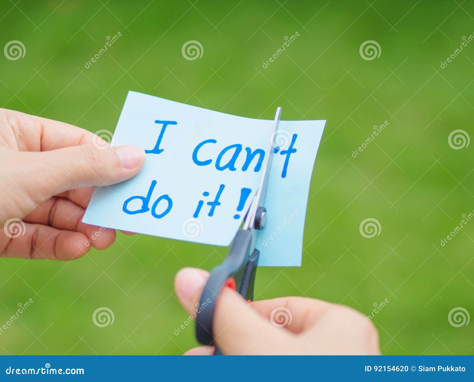 women using scissors to remove the word can`t to read i can do it concept for self belief,