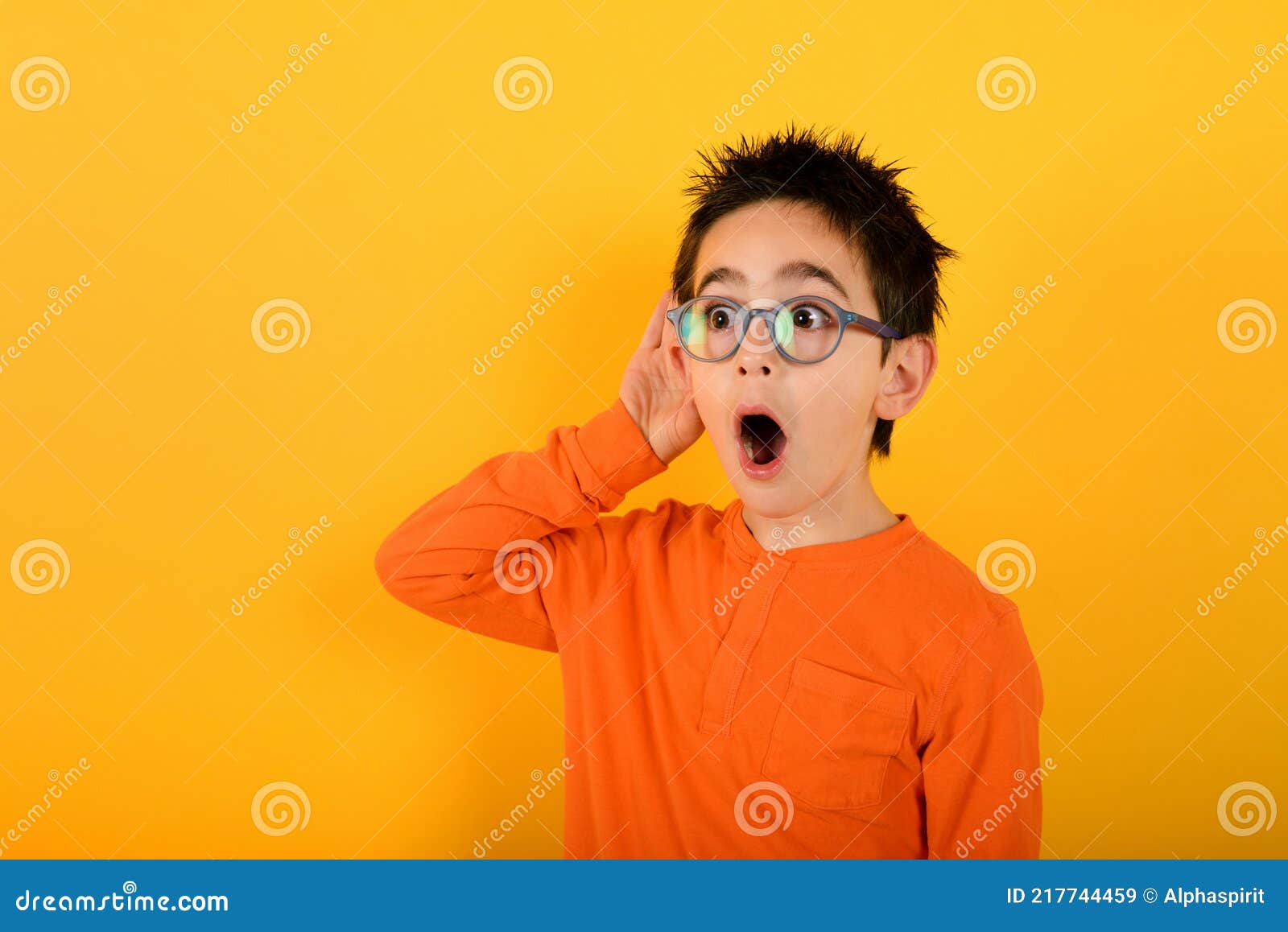 Wondered Child Ears Something. Concept of Gossip. Yellow Background