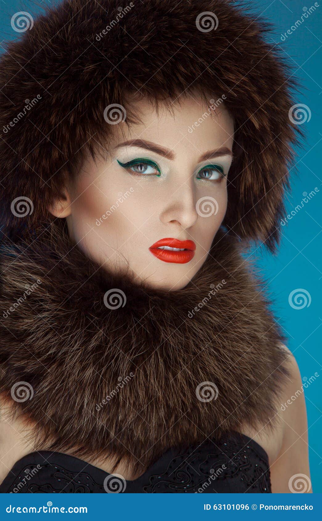 wonderful girl in a fur hat and scurf