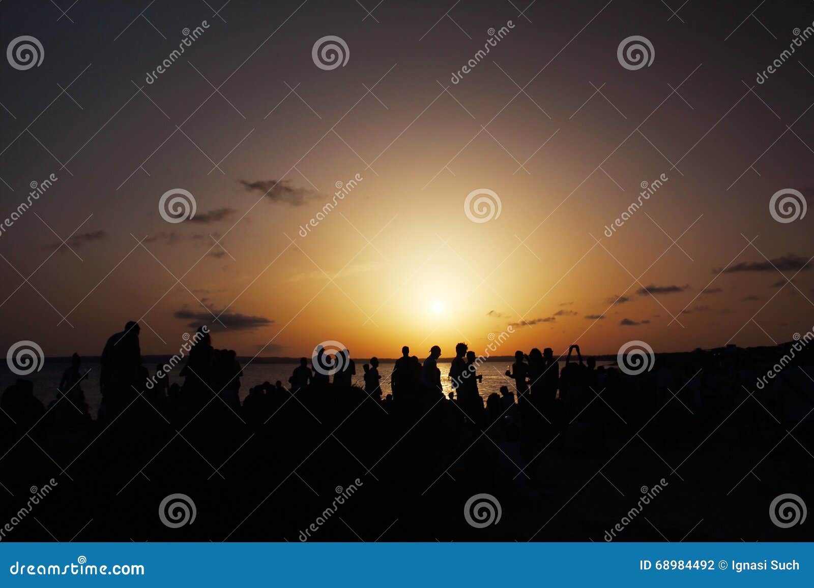 wonderful sunset celebrated by many people at pirata bus bar in formentera, balearicislands, spain